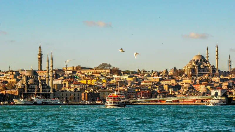 Istanbul's historic skyline of domes and minarets across the water at Eminönü