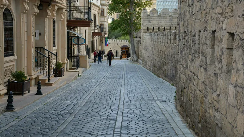 A cobbled lane running beside the old city wall in Icherisheher
