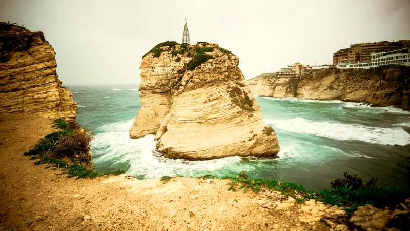 The Pigeon Rocks standing in turquoise water off the Beirut corniche