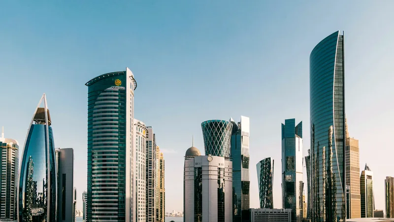 The towers of Doha's West Bay against a clear sky