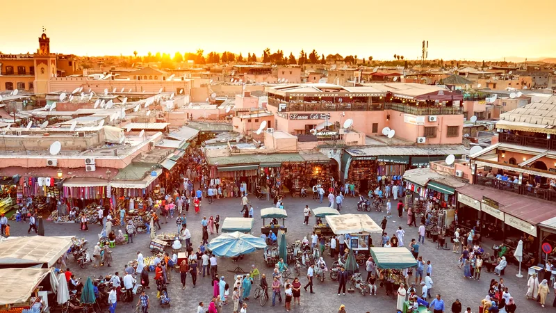 Market stalls filling the Jemaa el-Fnaa square in warm evening light