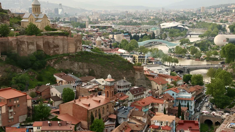 Red-tiled rooftops of Tbilisi's old town below the hilltop fortress