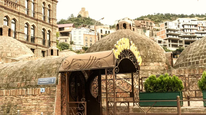 The brick domes and ornate entrance of the Abanotubani sulfur baths