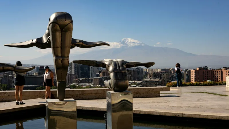 Sculptures at the Cascade looking out over Yerevan to snow-capped Mount Ararat