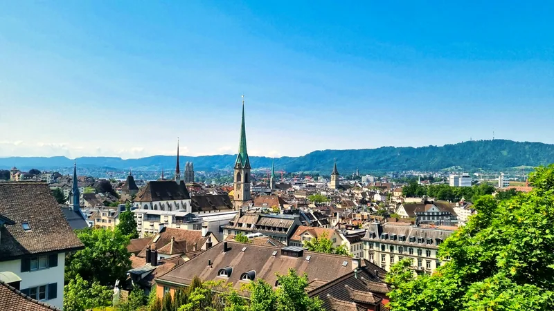 The rooftops and spires of Zurich's old town above the lake